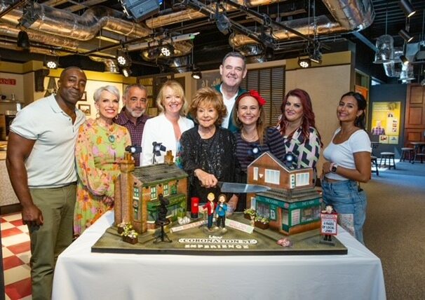 A group surrounds a display of coronation street